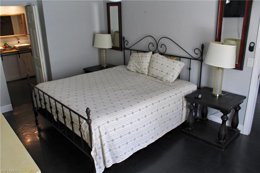 7328 Pebble Beach Road Fort Myers, FL 33967 - Photo 3 of 31 a bed room with a bed and a night stand