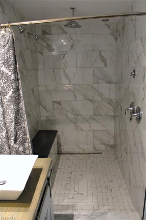 7328 Pebble Beach Road Fort Myers, FL 33967 - Photo 7 of 31 a bathroom with a shower