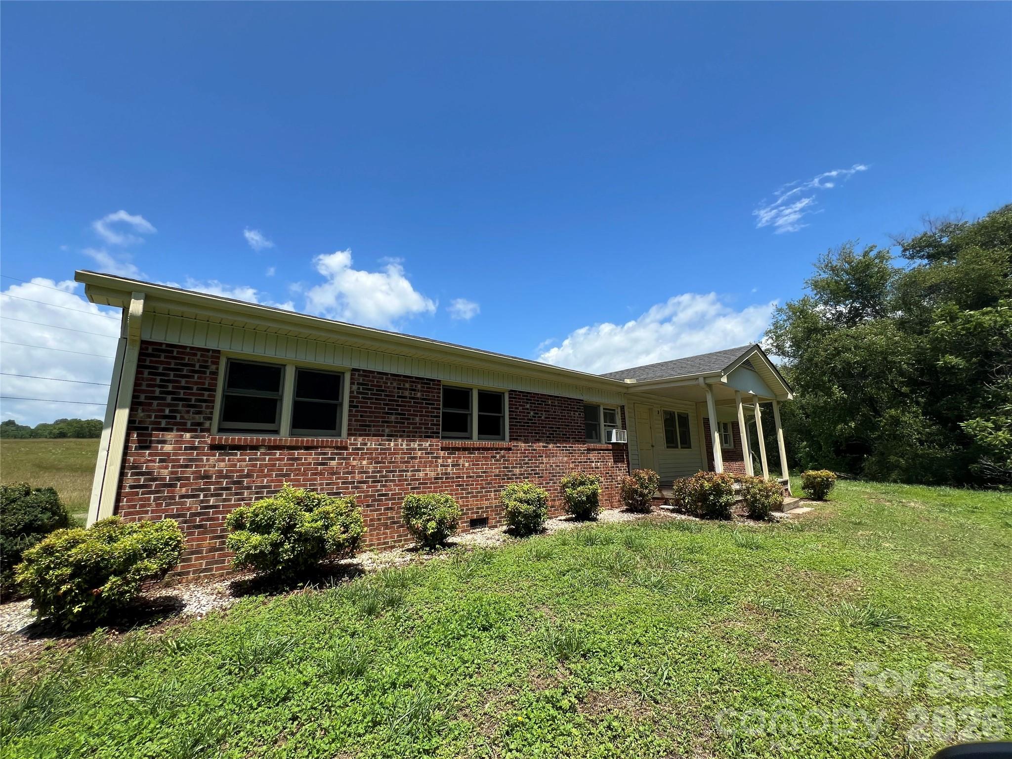 4405 Maple Creek Road Rutherfordton, NC 28139 - Photo 1 of 32 a front view of a house with garden