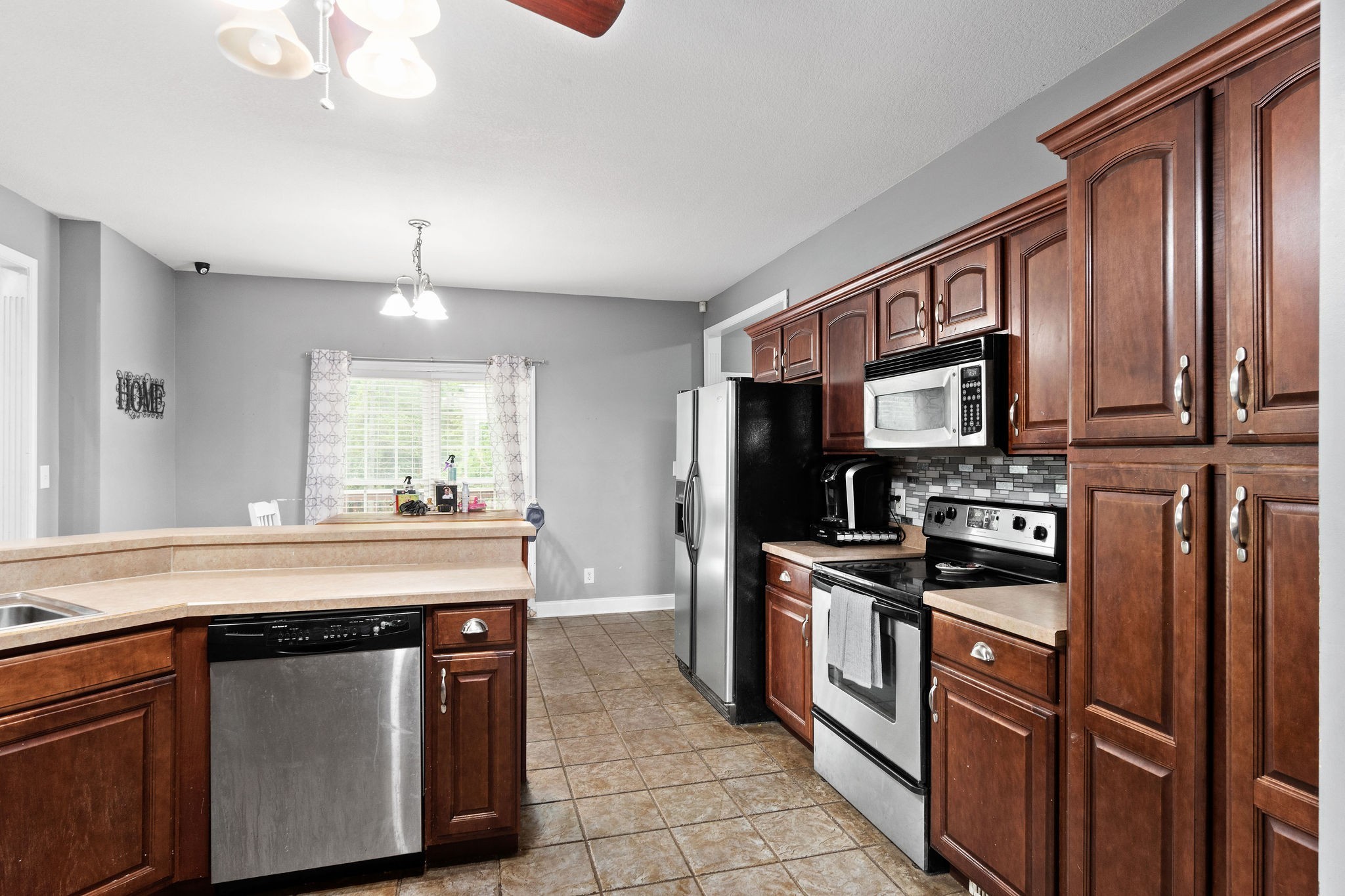 2458 Carroll Road Palmyra, TN 37142 - Photo 12 of 35 a kitchen with stainless steel appliances granite countertop a stove and a sink