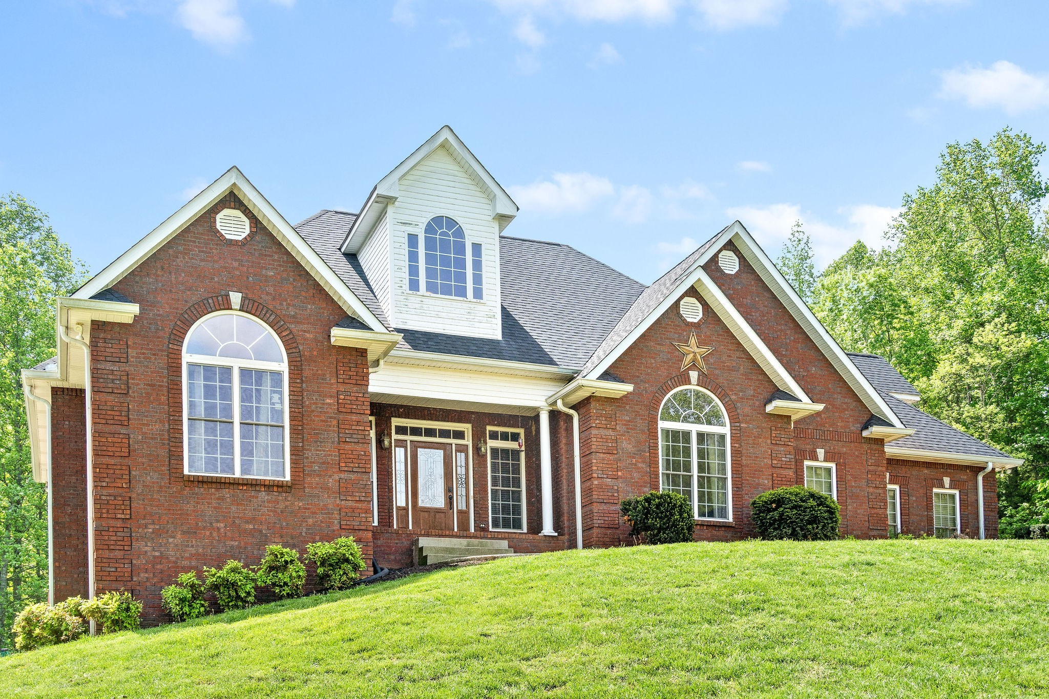 2458 Carroll Road Palmyra, TN 37142 - Photo 2 of 35 a front view of a house with a yard