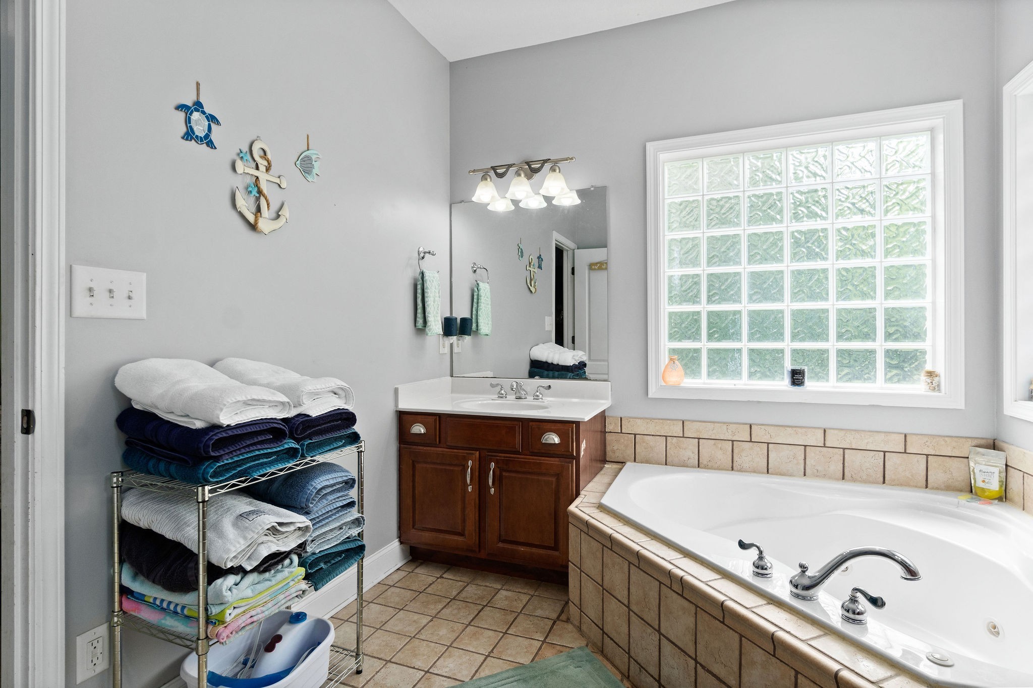 2458 Carroll Road Palmyra, TN 37142 - Photo 21 of 35 a bathroom with a tub sink and mirror