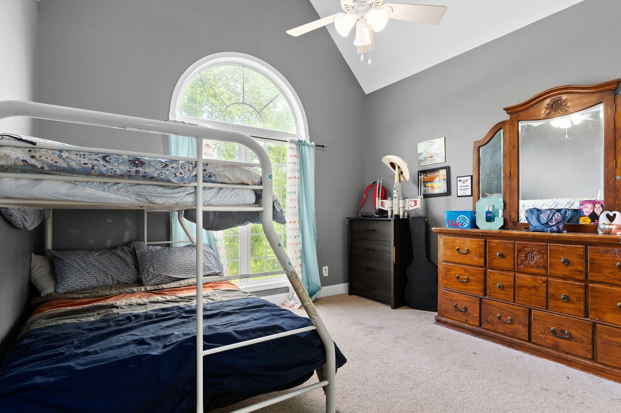2458 Carroll Road Palmyra, TN 37142 - Photo 23 of 35 a room with wooden cabinets and a window