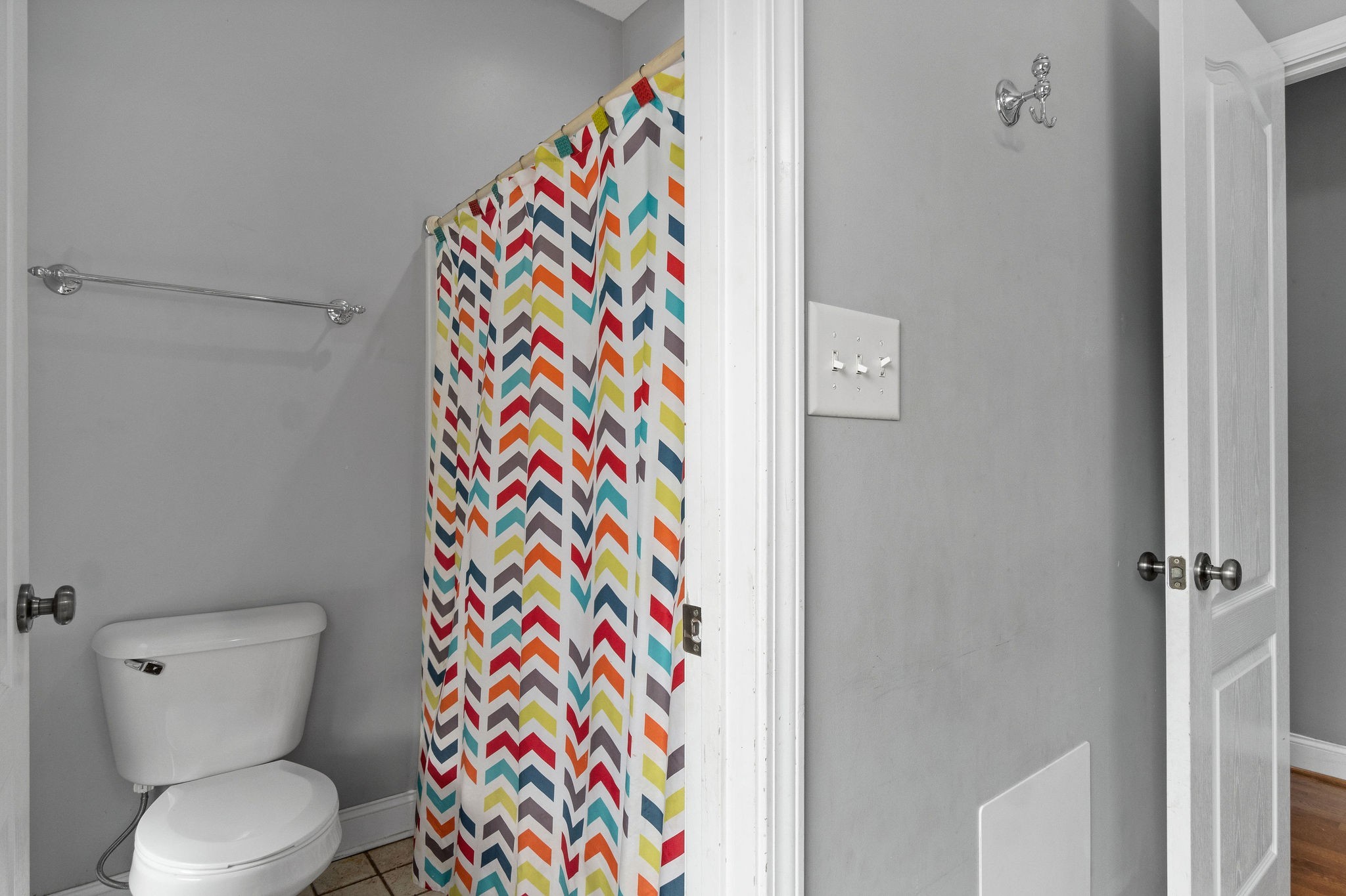 2458 Carroll Road Palmyra, TN 37142 - Photo 25 of 35 a bathroom with a toilet and shower curtain