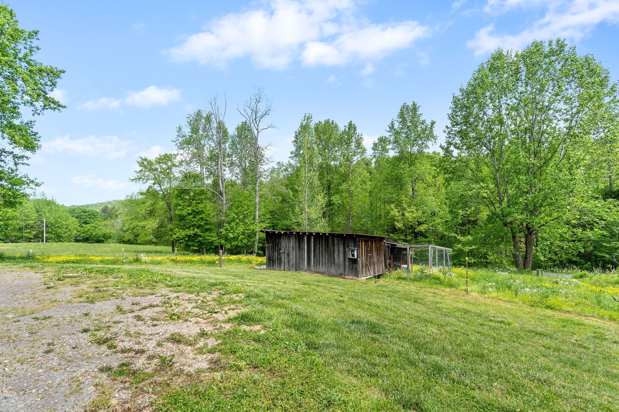 2458 Carroll Road Palmyra, TN 37142 - Photo 27 of 35 a view of a house with a yard