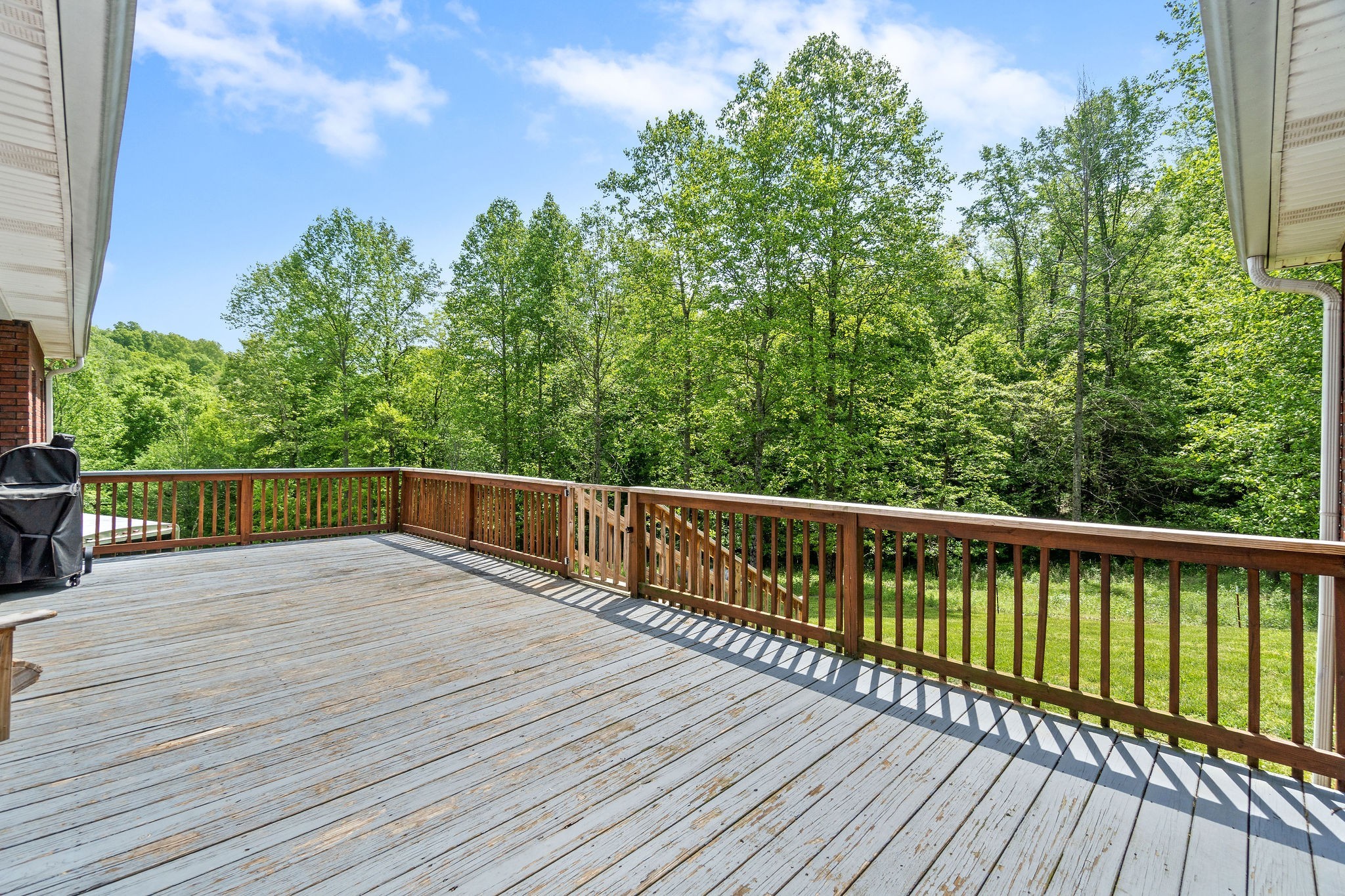 2458 Carroll Road Palmyra, TN 37142 - Photo 29 of 35 a balcony with wooden floor and fence