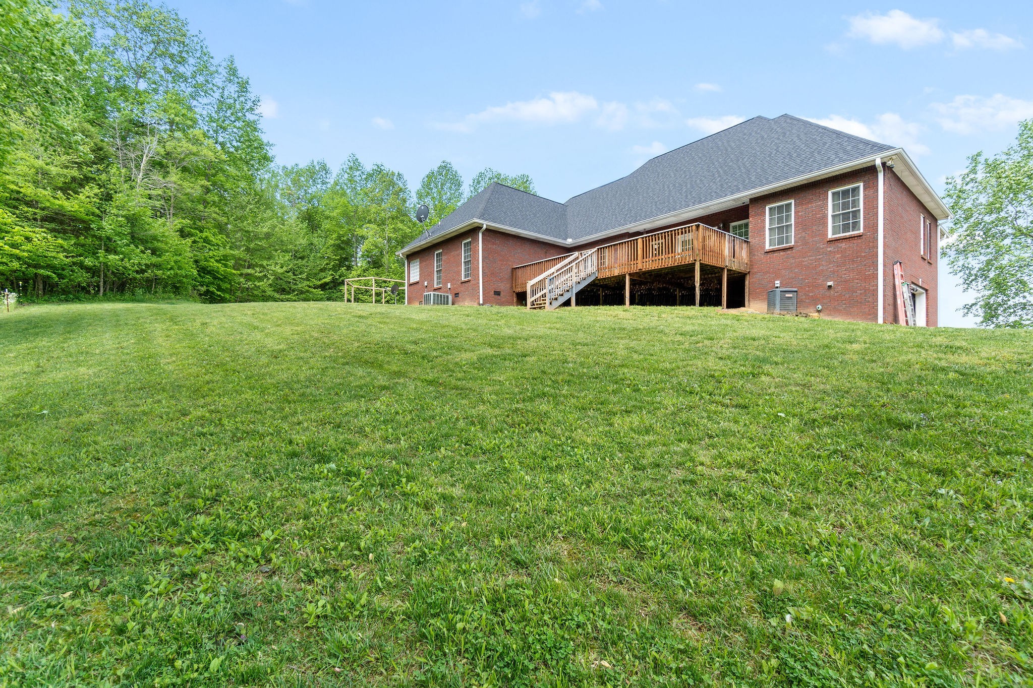 2458 Carroll Road Palmyra, TN 37142 - Photo 33 of 35 a front view of a house with garden