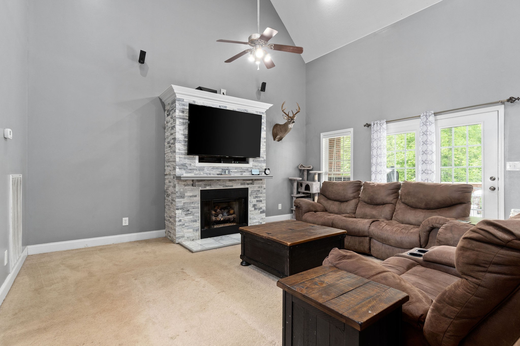 2458 Carroll Road Palmyra, TN 37142 - Photo 5 of 35 a living room with furniture a fireplace and a flat screen tv