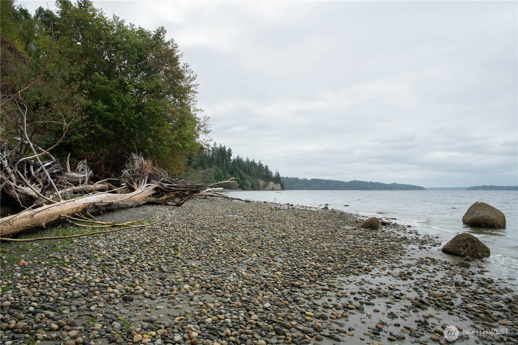 6206 Crescent Beach Road Vaughn, WA 98394 - Photo 4 of 22 a view of a lake with a yard