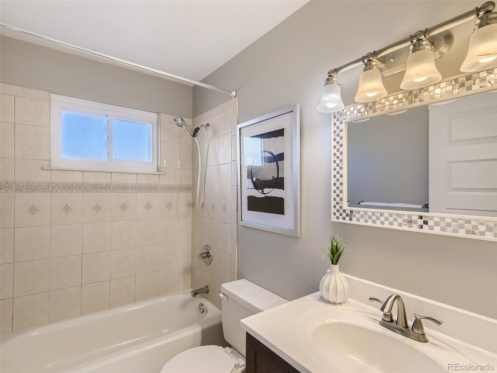 10390 Owens Circle Westminster, CO 80021 - Photo 20 of 28 a bathroom with a sink toilet and shower