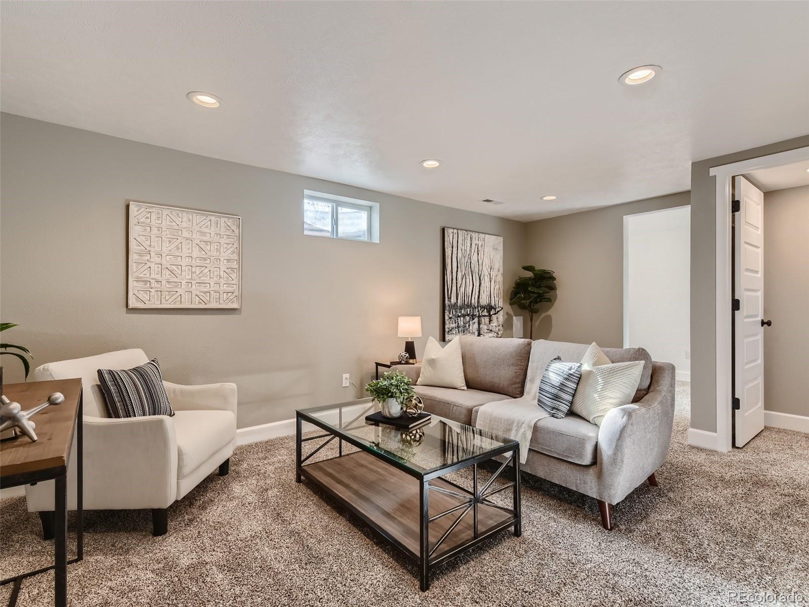 10390 Owens Circle Westminster, CO 80021 - Photo 21 of 28 a living room with furniture and a couch