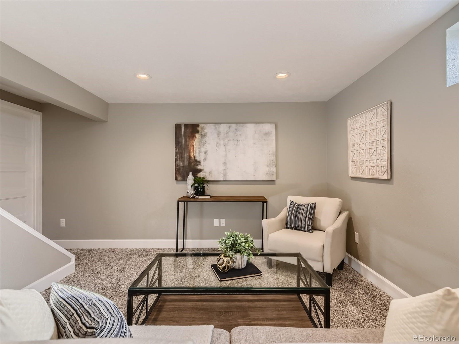 10390 Owens Circle Westminster, CO 80021 - Photo 22 of 28 a living room with furniture and a potted plant