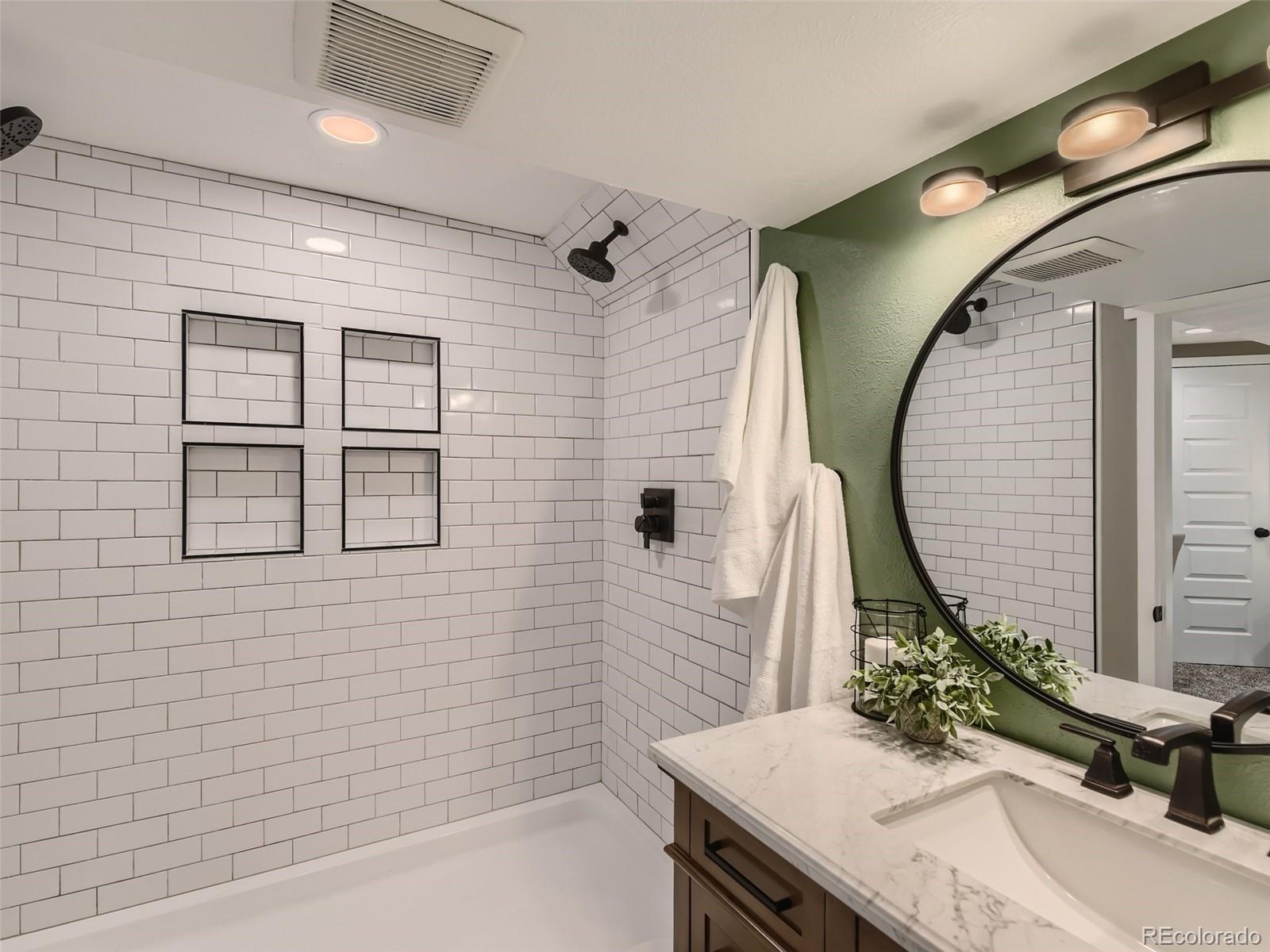 10390 Owens Circle Westminster, CO 80021 - Photo 25 of 28 a bathroom with a sink and a mirror
