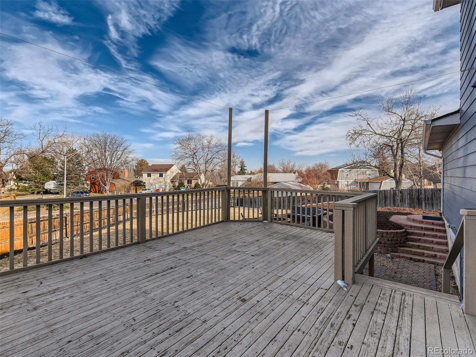 10390 Owens Circle Westminster, CO 80021 - Photo 26 of 28 a view of a balcony with wooden floor