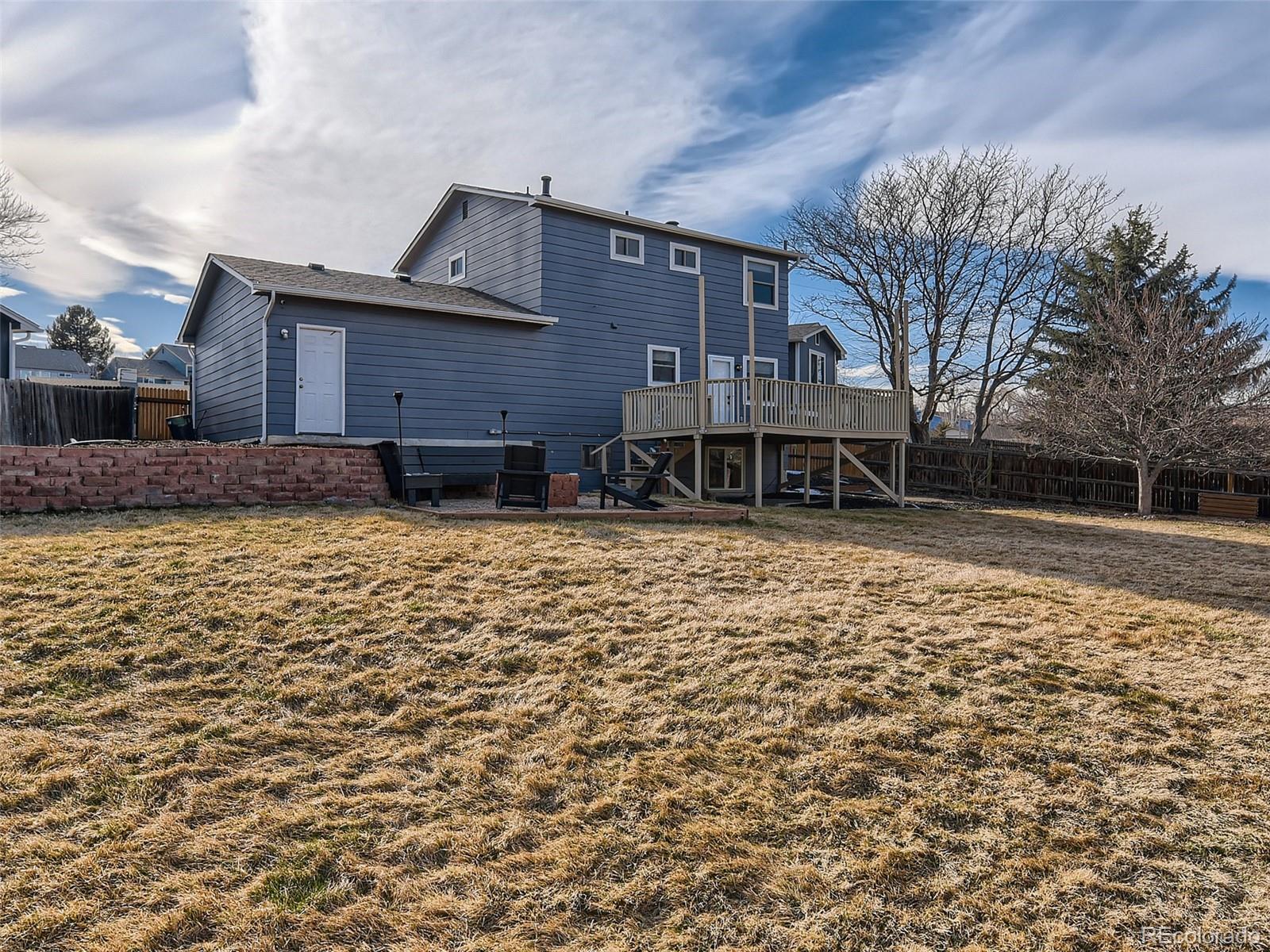 10390 Owens Circle Westminster, CO 80021 - Photo 27 of 28 a front view of house with yard