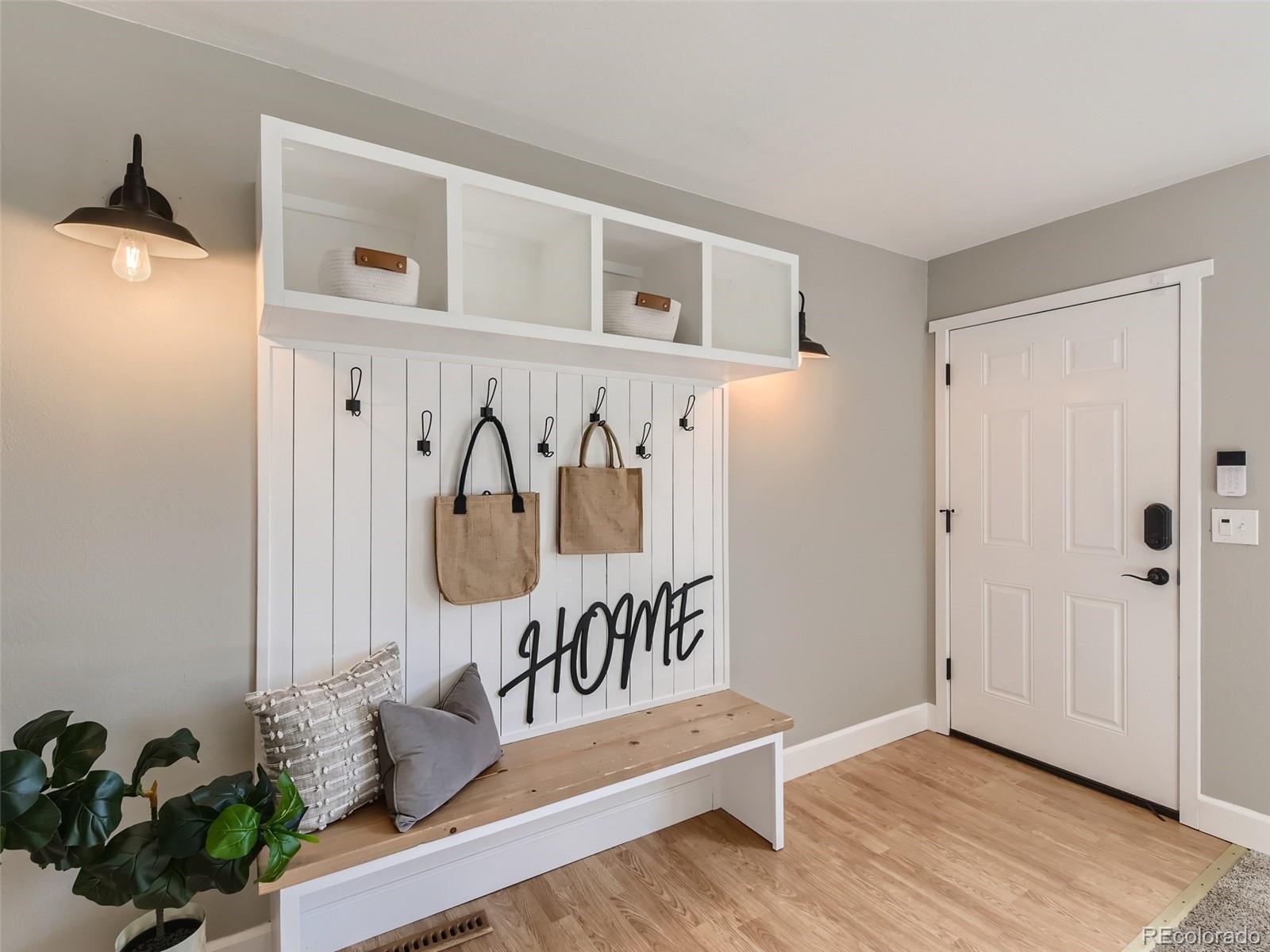 10390 Owens Circle Westminster, CO 80021 - Photo 4 of 28 a view of an entryway with wooden floor