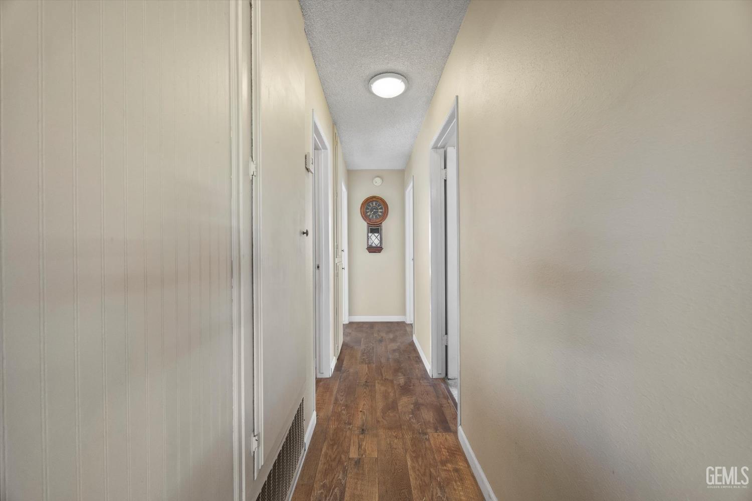 Undisclosed Address Tehachapi, CA 93561 - Photo 18 of 40 a view of a hallway with wooden floor