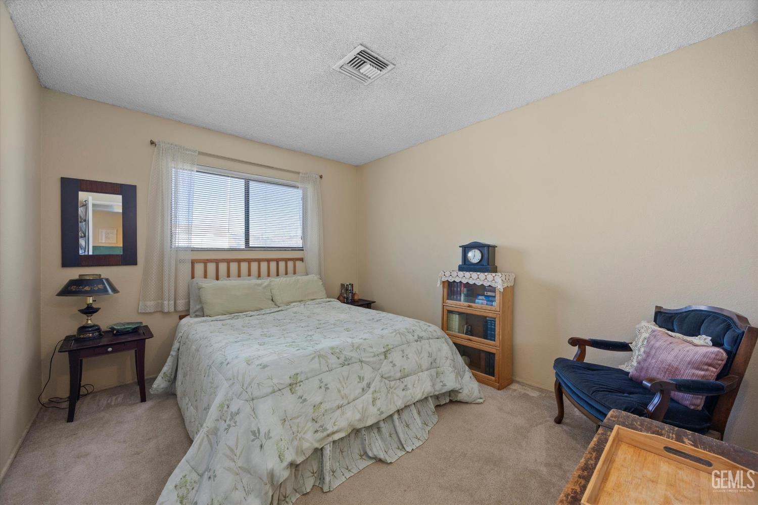Undisclosed Address Tehachapi, CA 93561 - Photo 19 of 40 a bedroom with a bed and a couch
