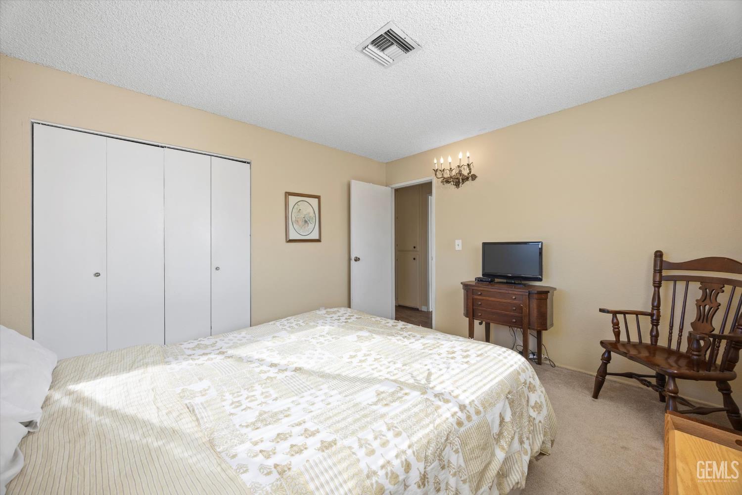 Undisclosed Address Tehachapi, CA 93561 - Photo 20 of 40 a bedroom with a bed and a television