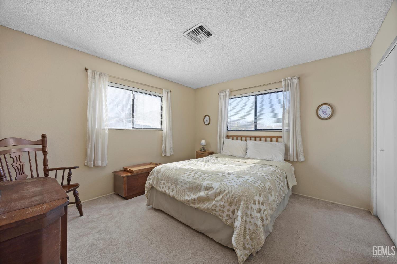 Undisclosed Address Tehachapi, CA 93561 - Photo 21 of 40 a bedroom with a bed and window