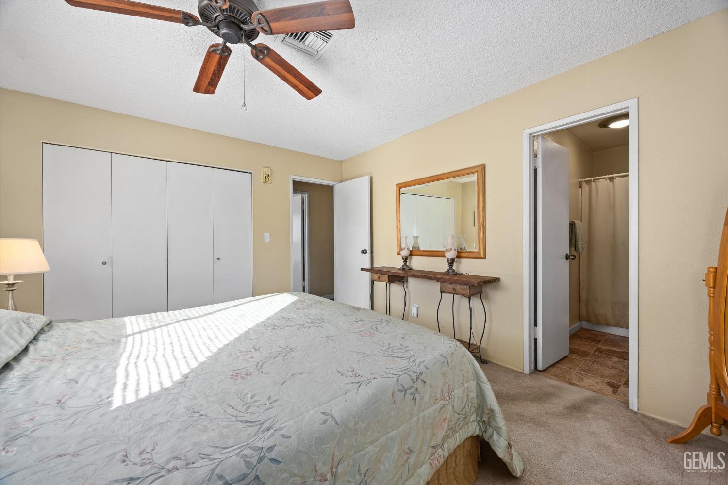 Undisclosed Address Tehachapi, CA 93561 - Photo 23 of 40 a bedroom with a bed and a chandelier