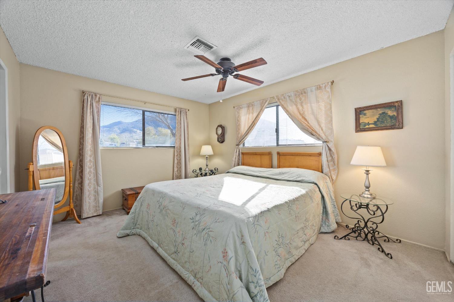 Undisclosed Address Tehachapi, CA 93561 - Photo 24 of 40 a bedroom with a bed mirror and window