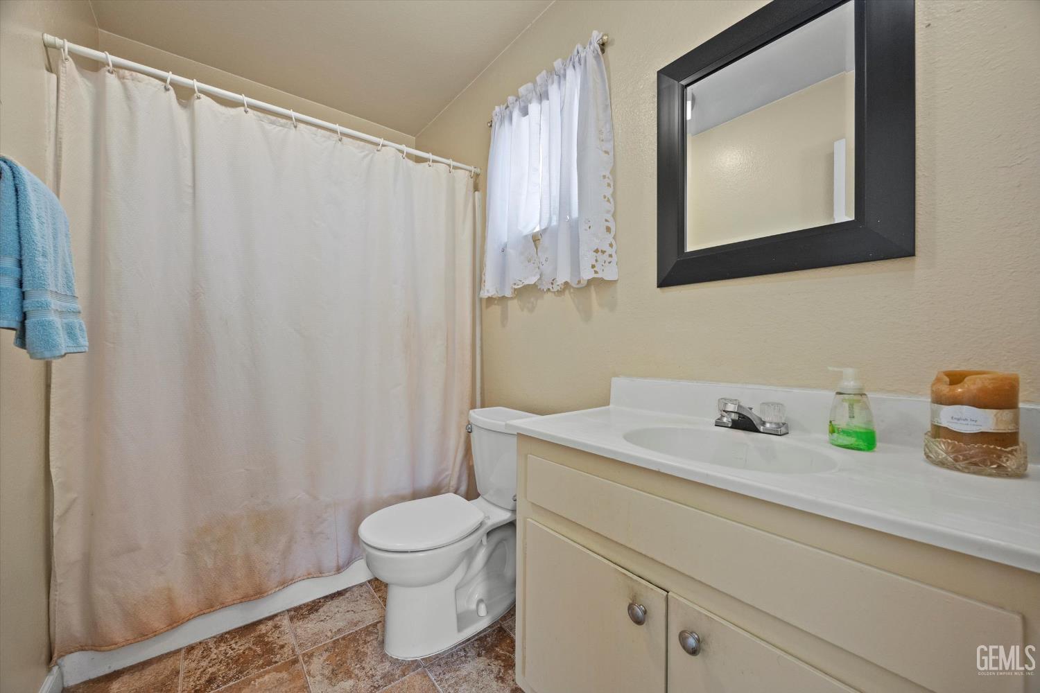 Undisclosed Address Tehachapi, CA 93561 - Photo 25 of 40 a bathroom with a sink a toilet and a mirror