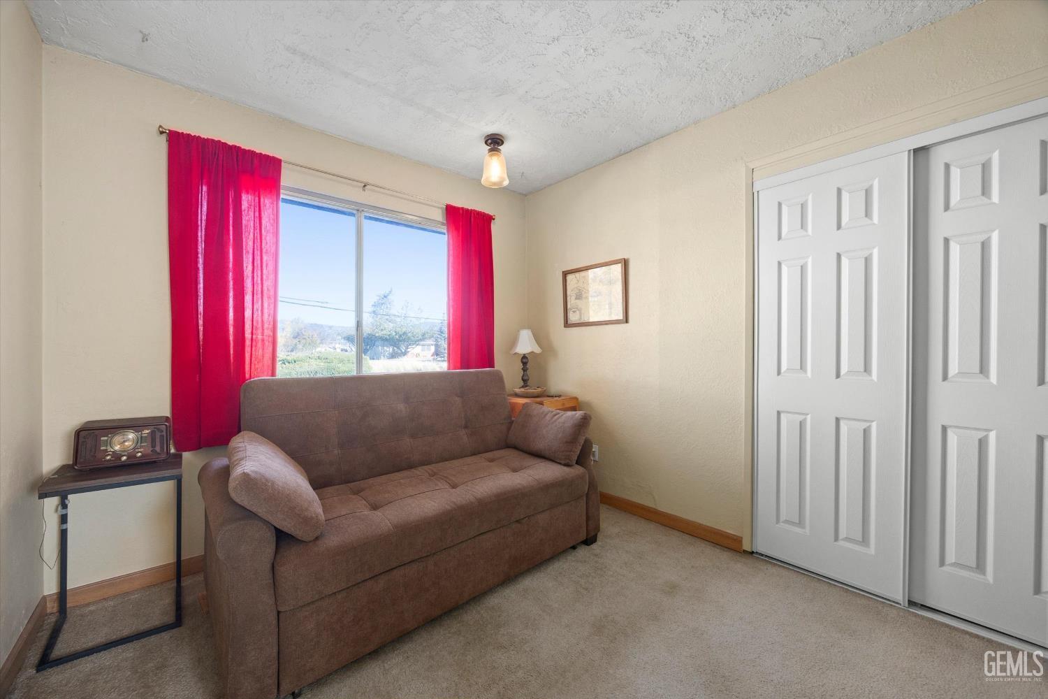 Undisclosed Address Tehachapi, CA 93561 - Photo 27 of 40 a living room with furniture and a window