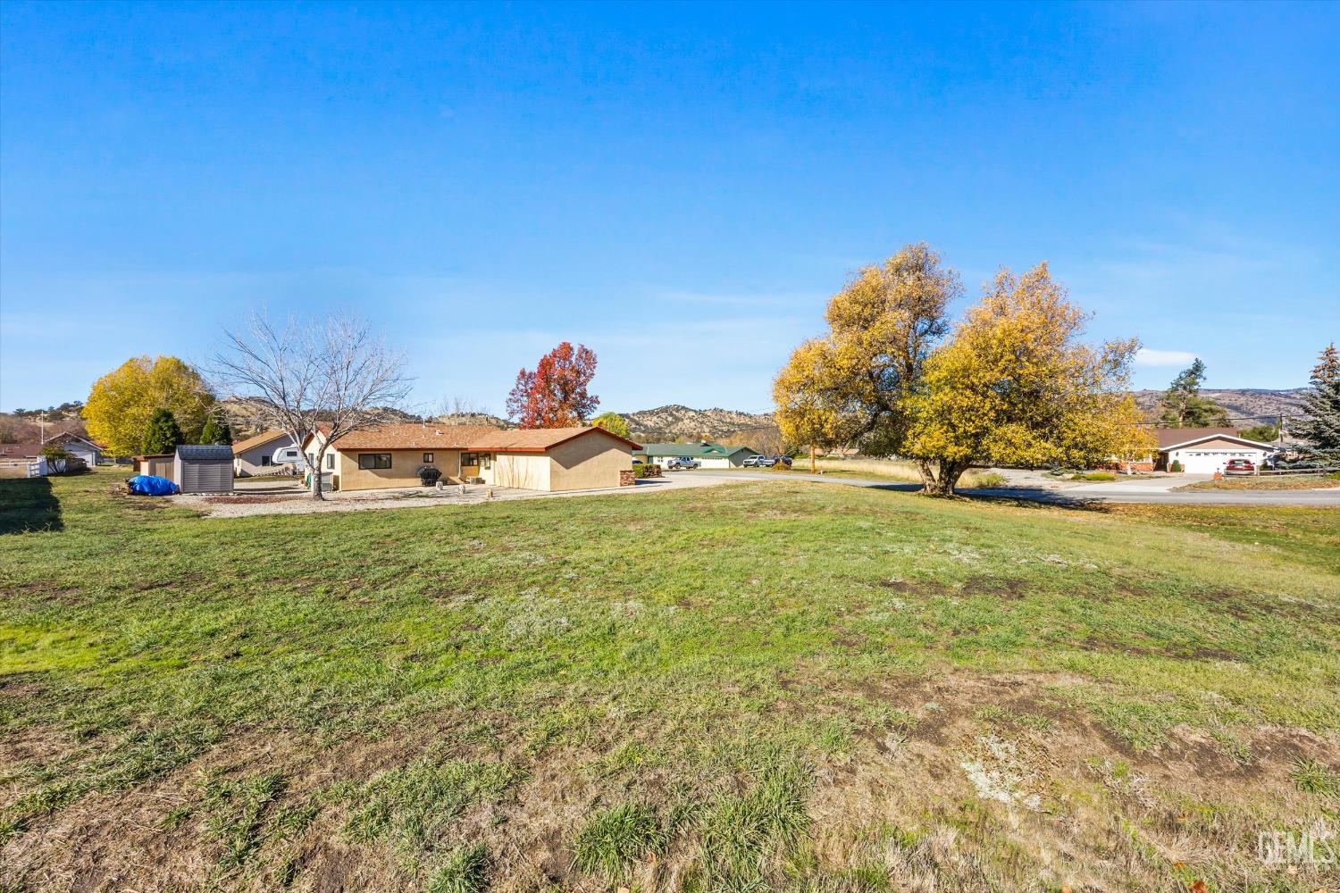 Undisclosed Address Tehachapi, CA 93561 - Photo 30 of 40 a backyard of a house with lots of green space