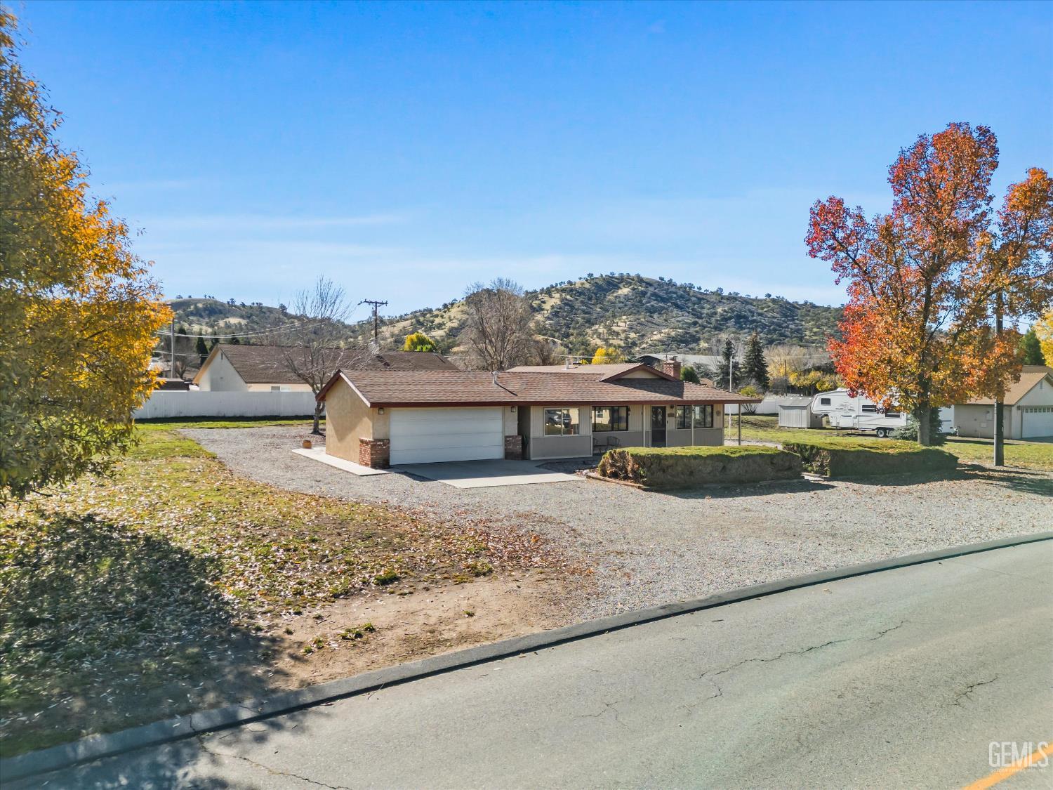 Undisclosed Address Tehachapi, CA 93561 - Photo 4 of 40 a view of a house with a yard