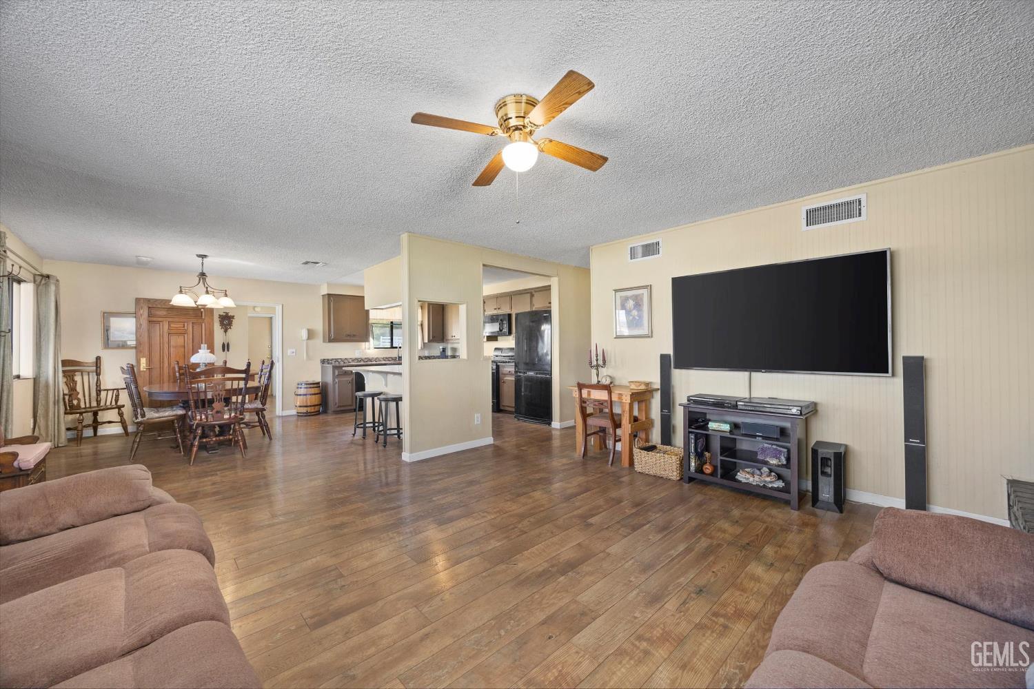 Undisclosed Address Tehachapi, CA 93561 - Photo 9 of 40 a living room with furniture and a flat screen tv