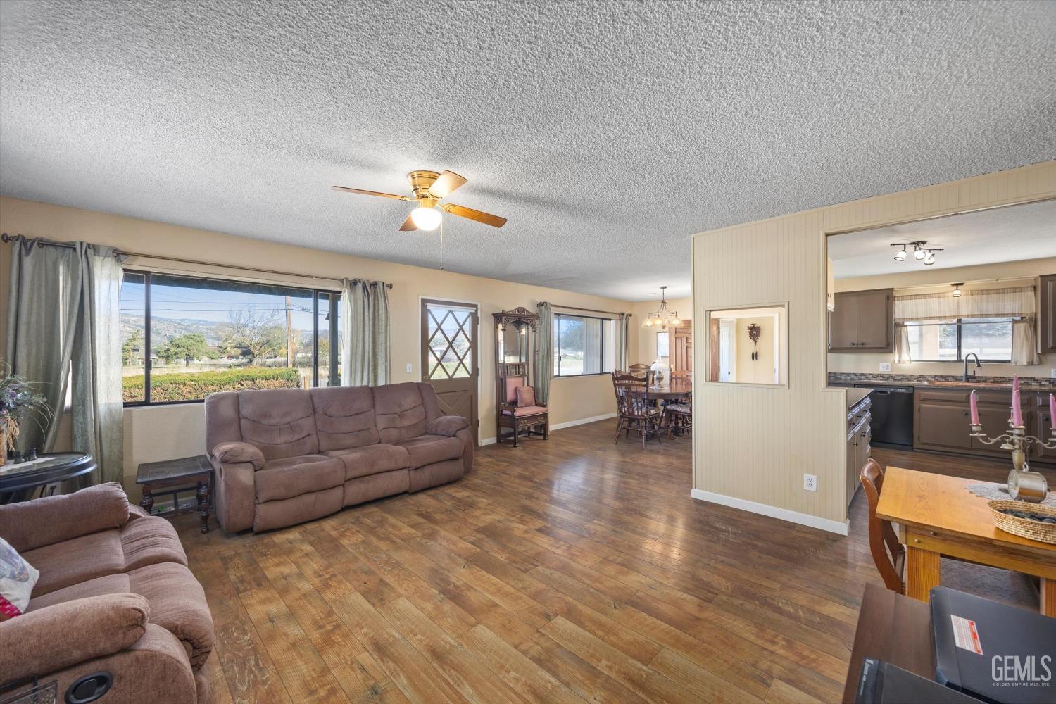 Undisclosed Address Tehachapi, CA 93561 - Photo 10 of 40 a living room with furniture and a flat screen tv