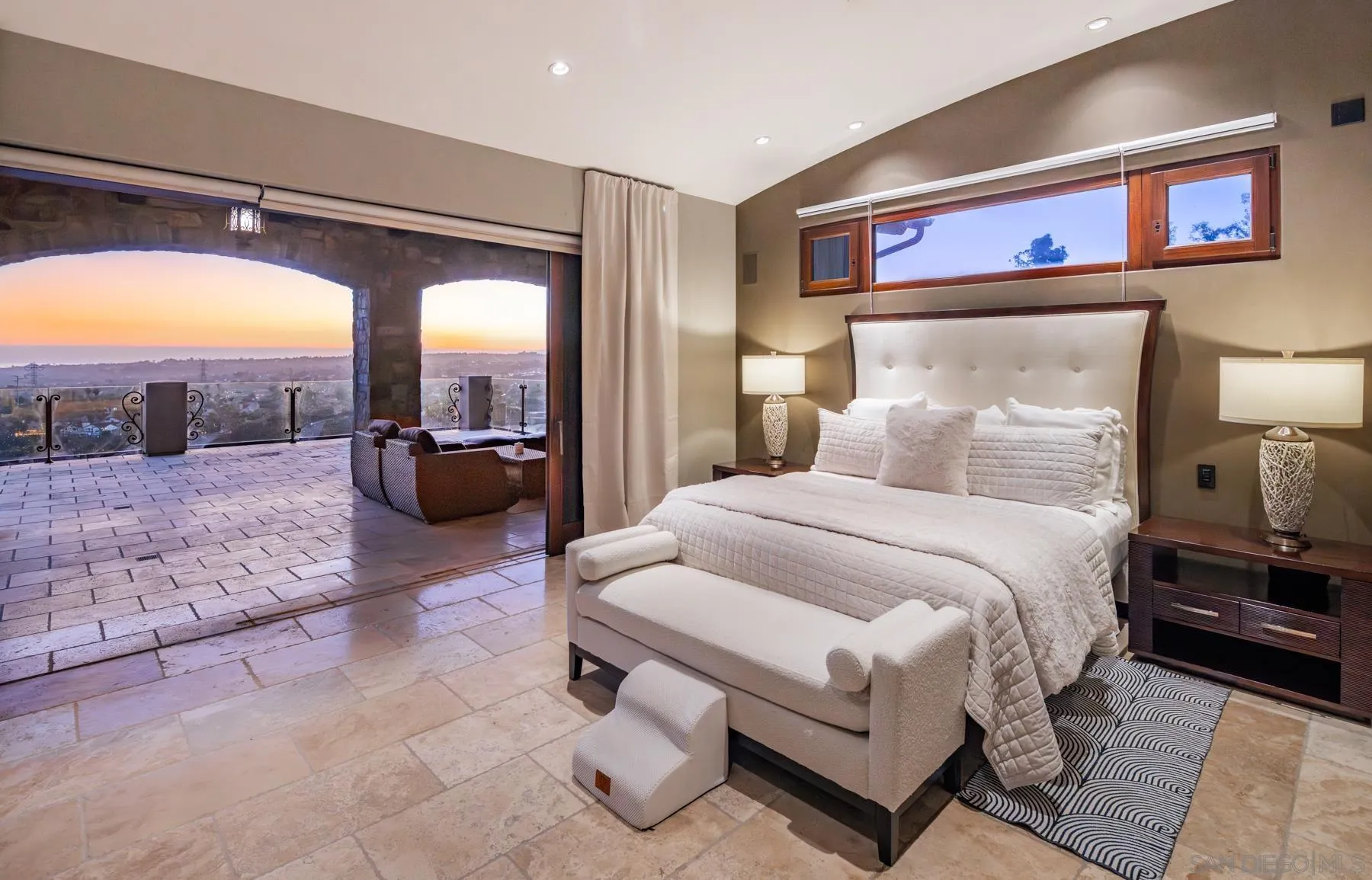 2647 Marmol Court Carlsbad, CA 92009 - Photo 16 of 35 a spacious bedroom with a bed and glass walk in closet