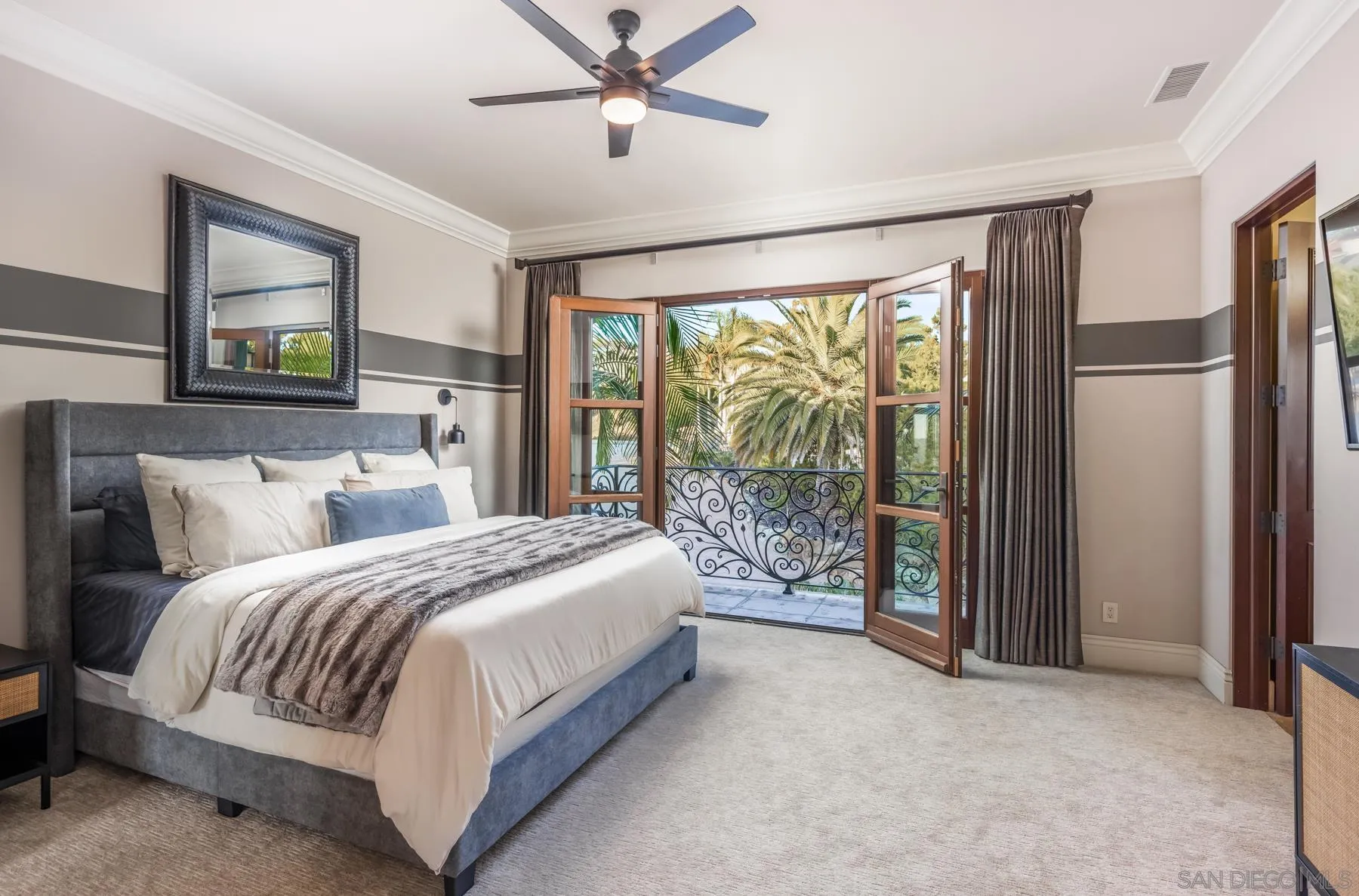 2647 Marmol Court Carlsbad, CA 92009 - Photo 21 of 35 a bed sitting in a spacious bedroom next to a window