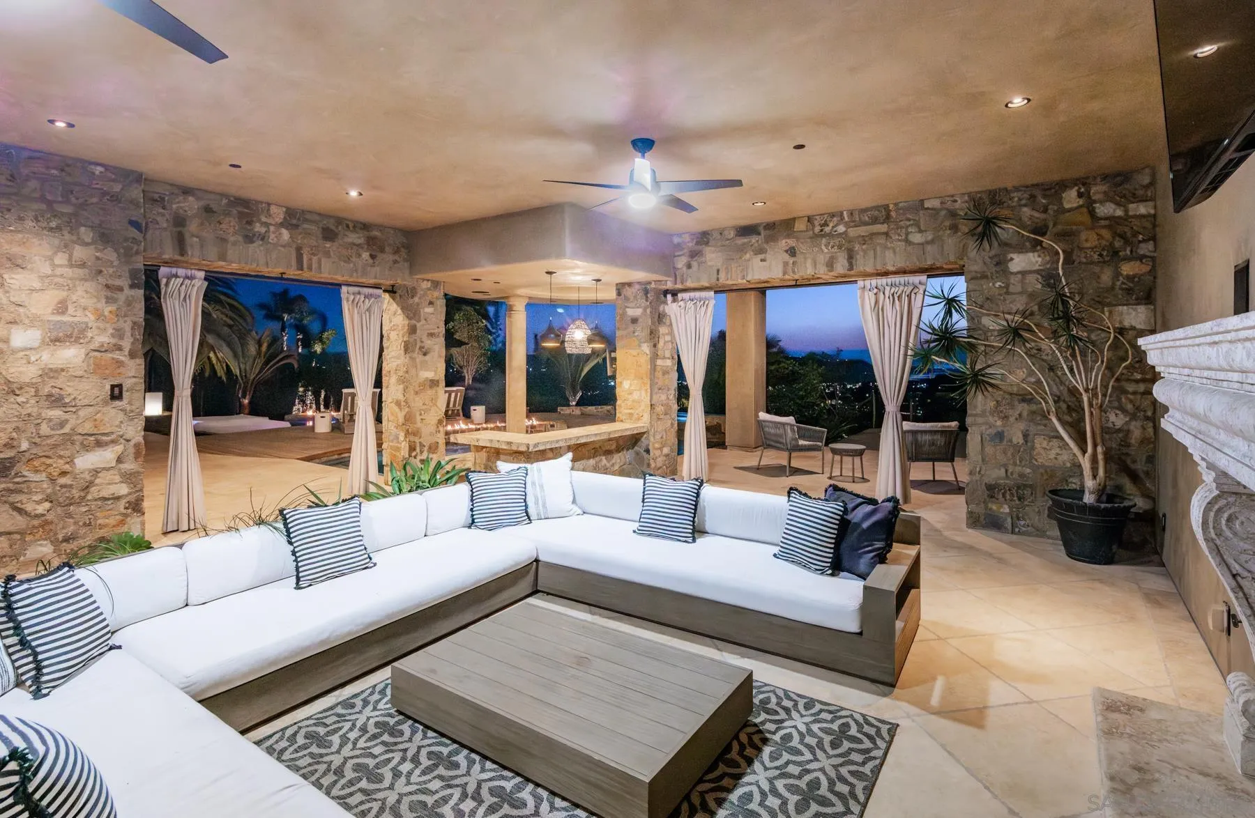 2647 Marmol Court Carlsbad, CA 92009 - Photo 30 of 35 a living room with furniture and a flat screen tv