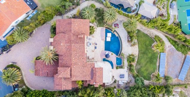 an aerial view of a house with a garden