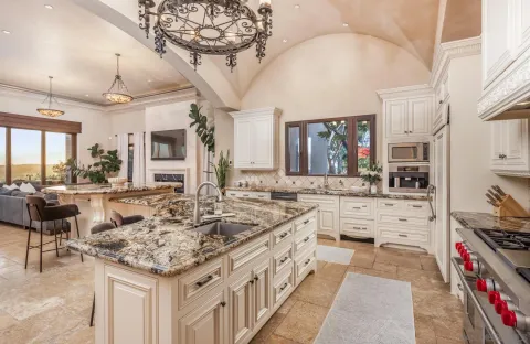 a large white kitchen with lots of counter space