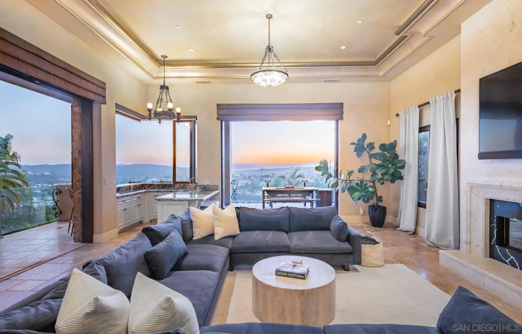 2647 Marmol Court Carlsbad, CA 92009 - Photo 9 of 35 a living room with furniture a chandelier and a large window