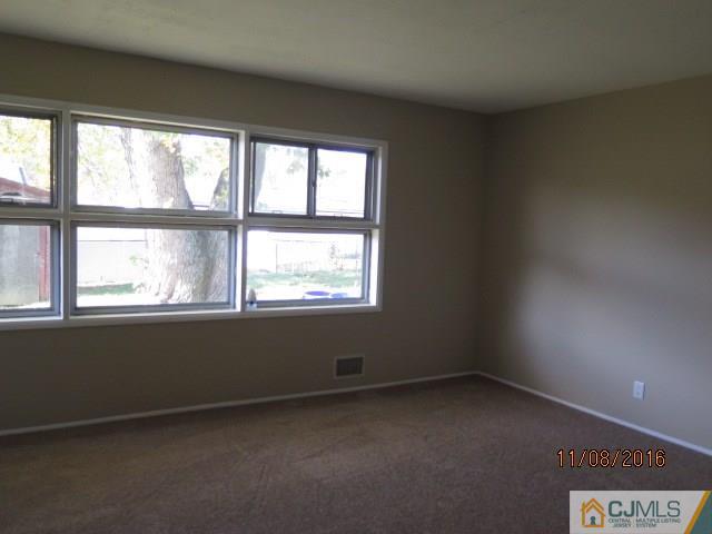 27 Clemson Road Old Bridge, NJ 08859 - Photo 12 of 18 an empty room with a window