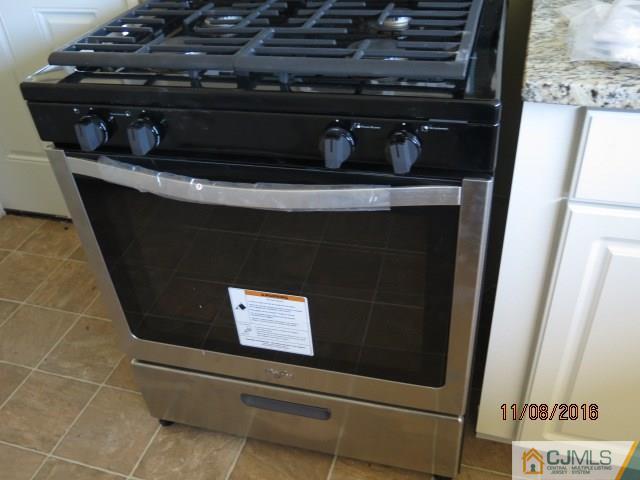 27 Clemson Road Old Bridge, NJ 08859 - Photo 14 of 18 a close view of a stove