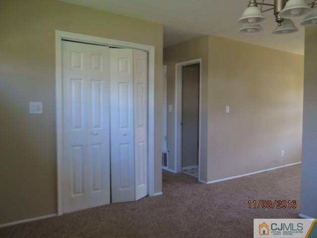 27 Clemson Road Old Bridge, NJ 08859 - Photo 4 of 18 a view of a hallway with closet area