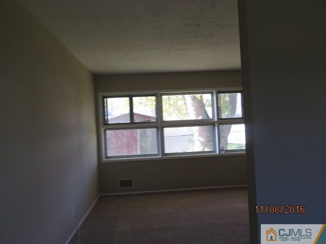 27 Clemson Road Old Bridge, NJ 08859 - Photo 6 of 18 a view of an empty room with a window
