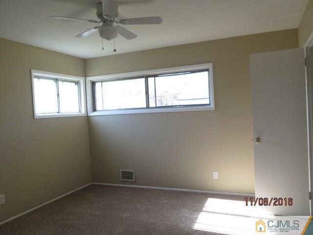 27 Clemson Road Old Bridge, NJ 08859 - Photo 10 of 18 a view of an empty room with a window