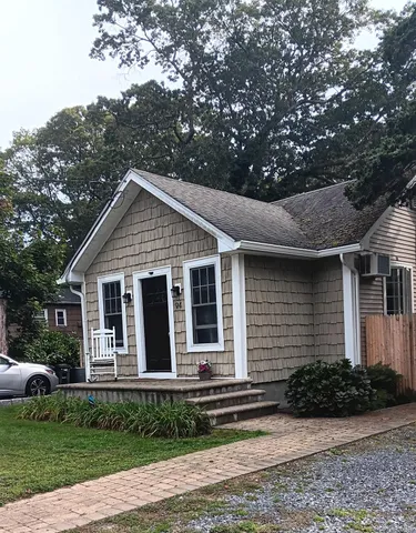 a view of front of house with a yard
