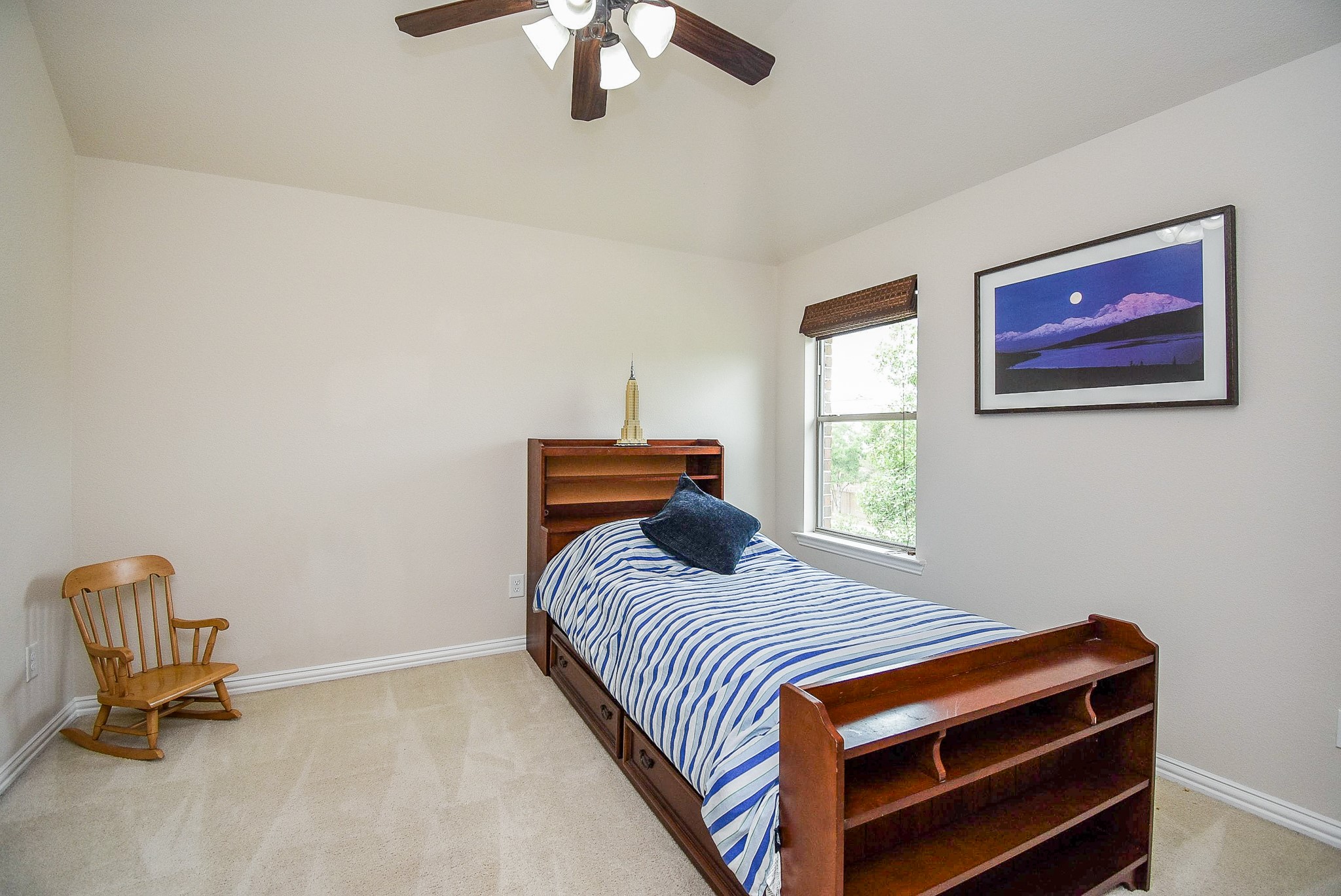 27427 Guthrie Ridge Lane Katy, TX 77494 - Photo 36 of 48 a bedroom with a bed and a chandelier