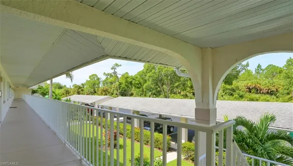 a view of a small yard from a balcony