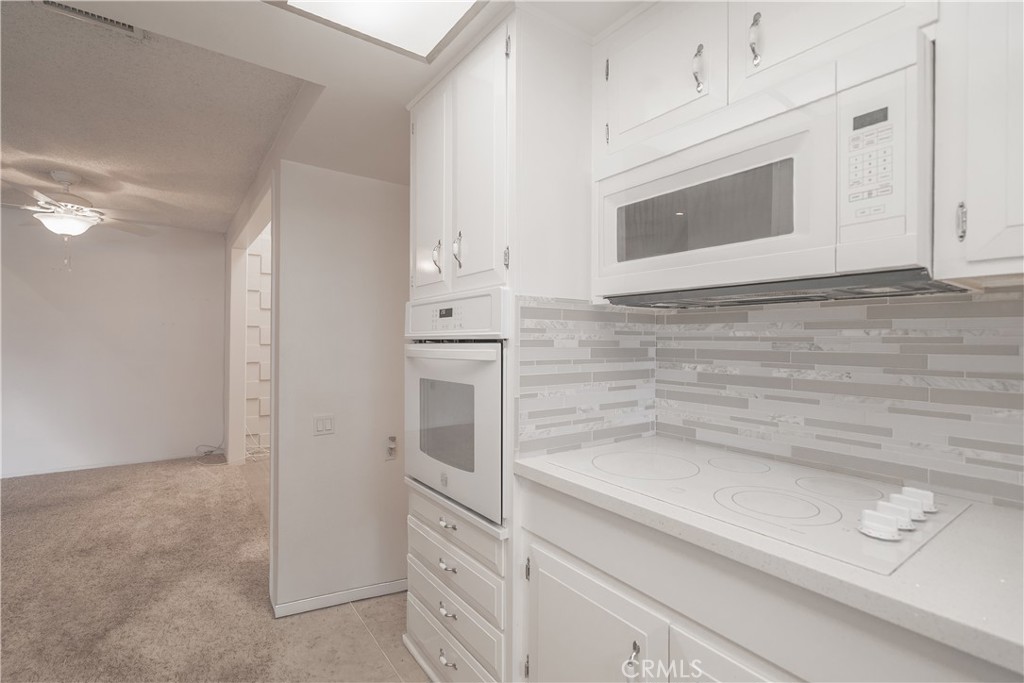 1880 St John Road Seal Beach, CA 90740 - Photo 11 of 30 a bathroom with a sink and a mirror