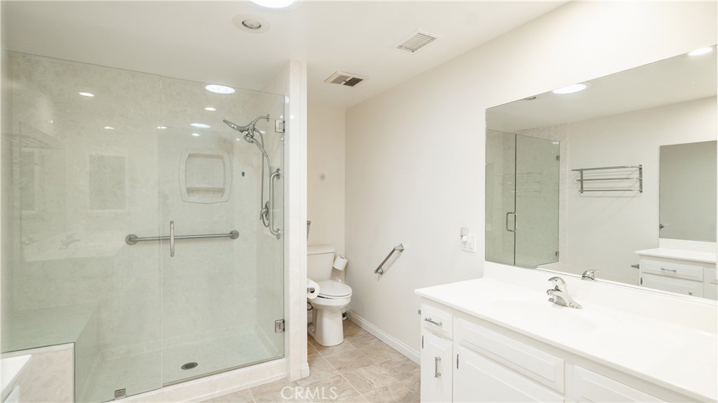 1880 St John Road Seal Beach, CA 90740 - Photo 21 of 30 a bathroom with a sink a toilet and shower