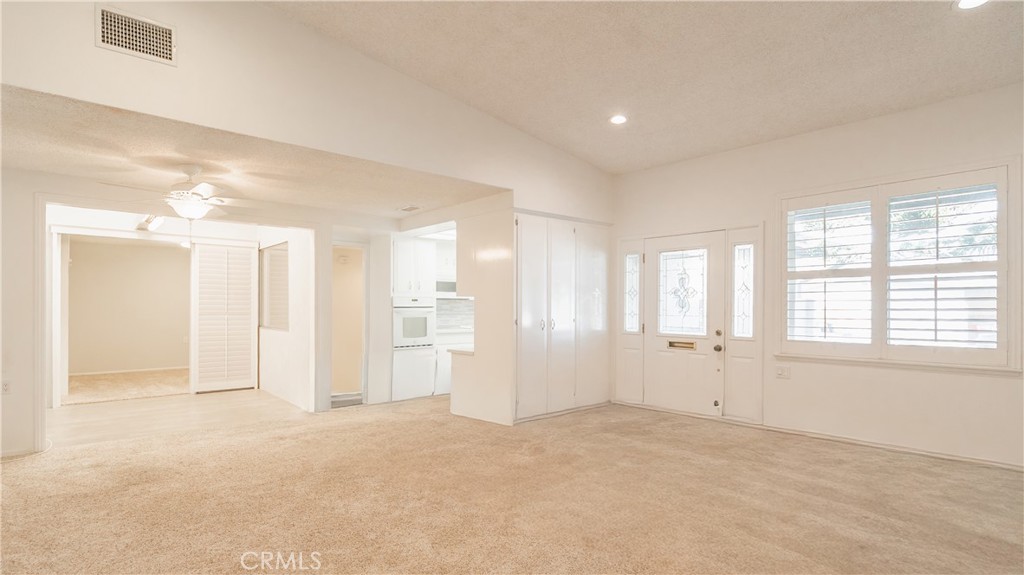 1880 St John Road Seal Beach, CA 90740 - Photo 6 of 30 an empty room with windows and closet