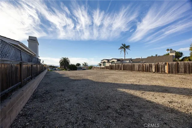 a swimming pool with outdoor seating and yard